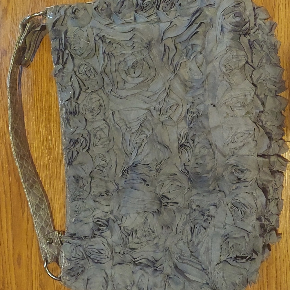 Grey flower embellishments on snake-skin type of shoulder bag